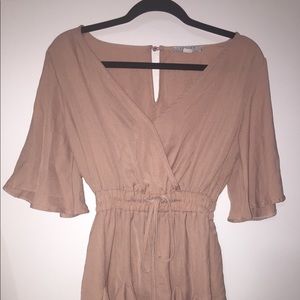 V neck short jumpsuit romper in a color of beige